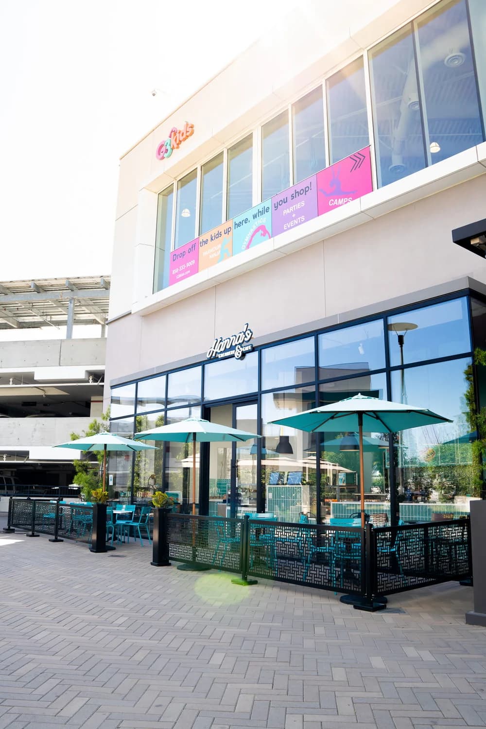 Hanna’s storefront and teal patio umbrellas at Westfield UTC