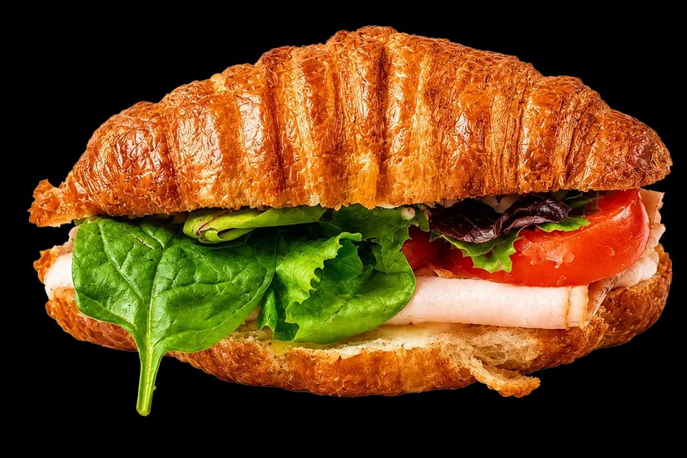 Croissant sandwich with fresh vegetables