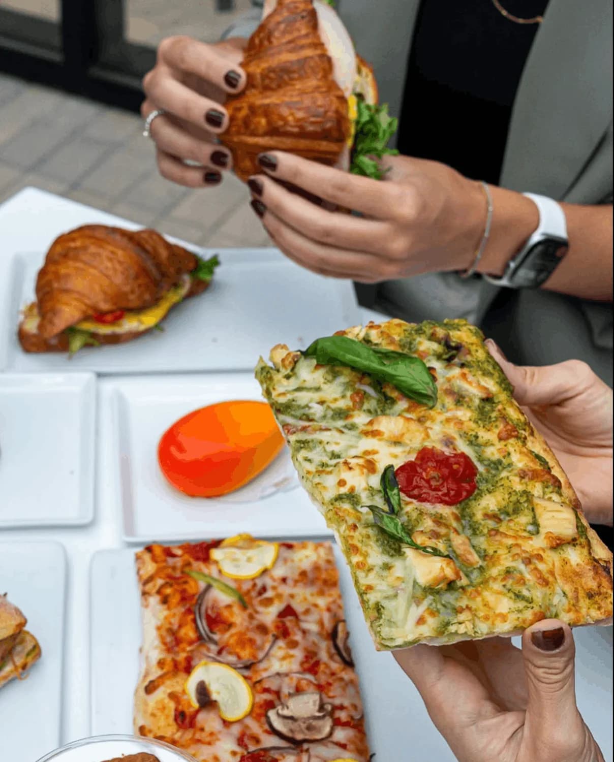 Sharing pastries and savory café favorites at a table